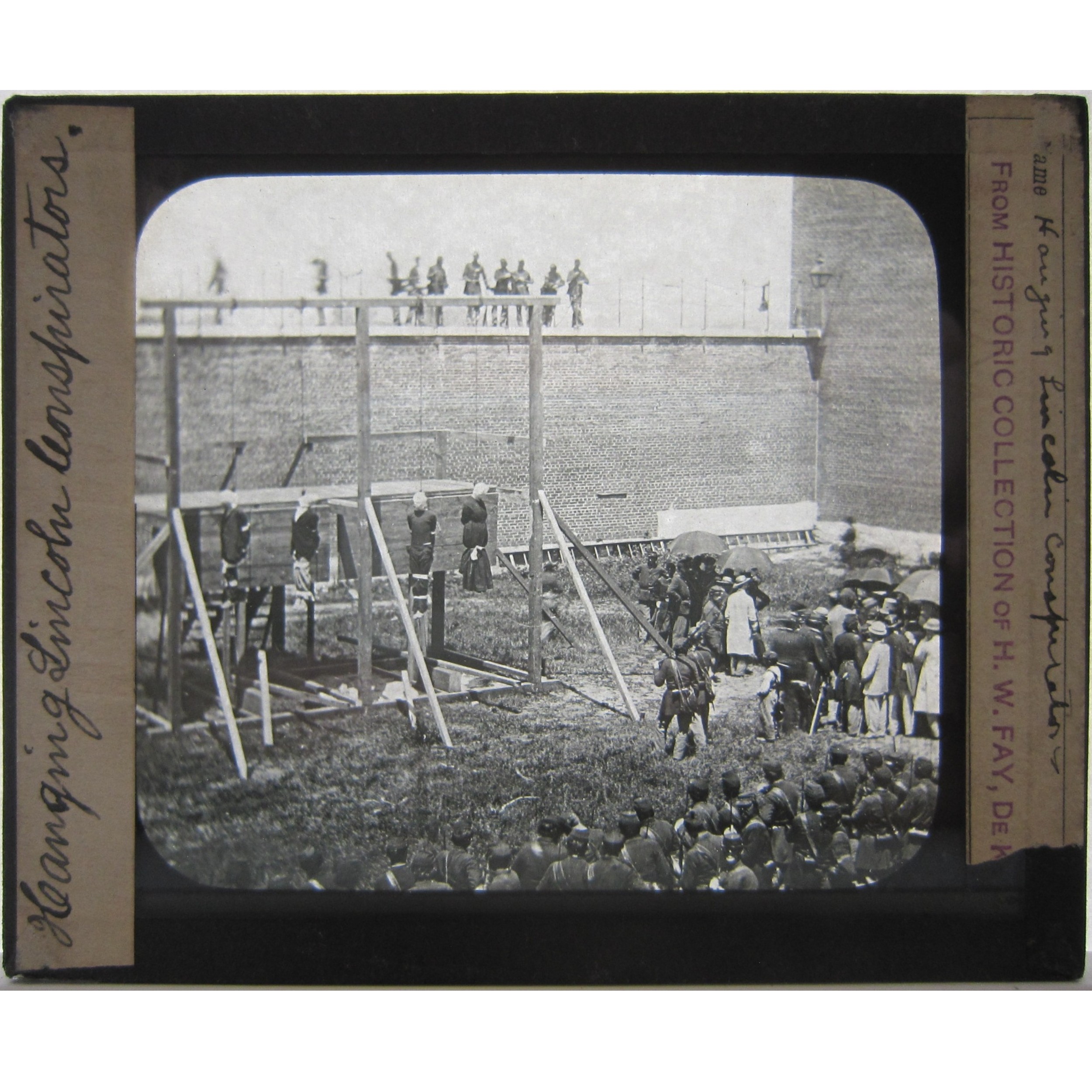 Glass slide of the hanging of Lincoln conspirators. July 7, 1865