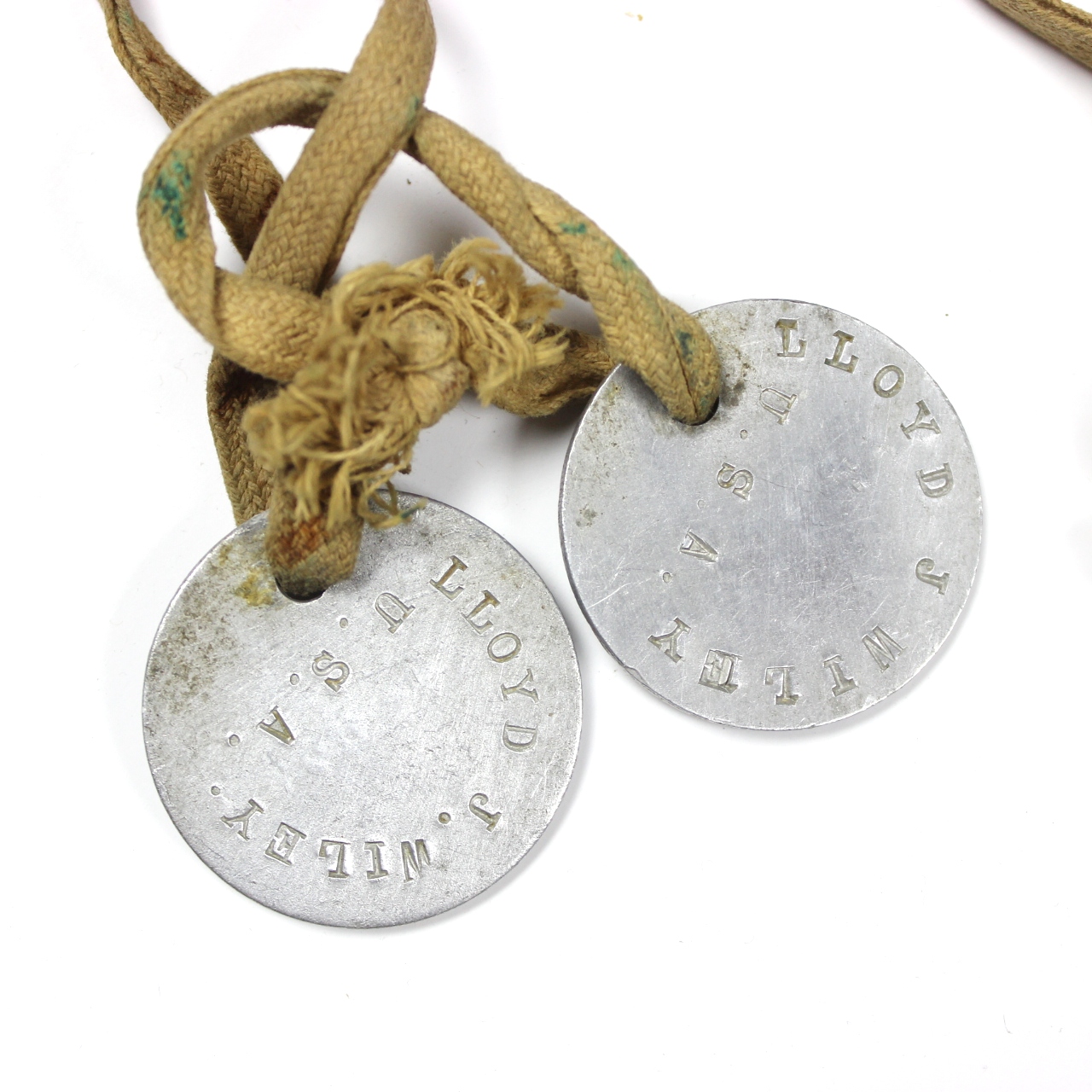 Pair of dog-tags w/ original cotton cord