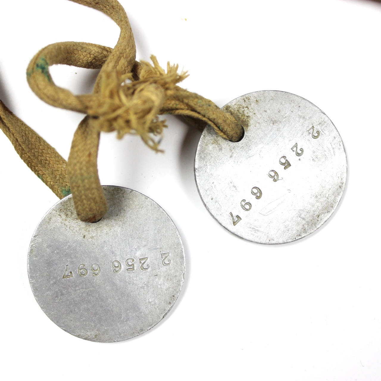 Pair of dog-tags w/ original cotton cord